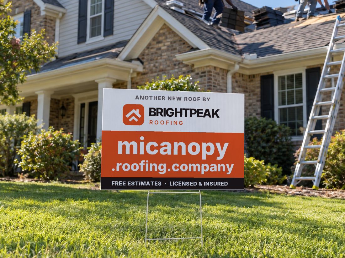micanopy.roofing.company on a yard sign in front of a house getting a new roof